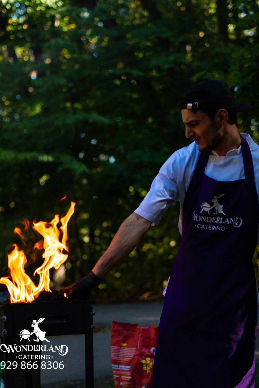 Chef beside the live fire