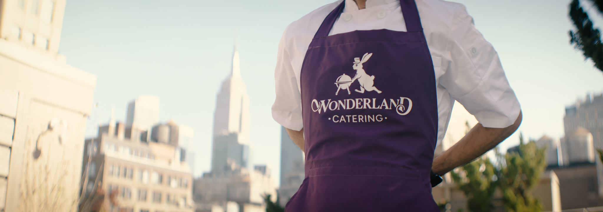 Branded catering apron in front of the Manhattan skyline