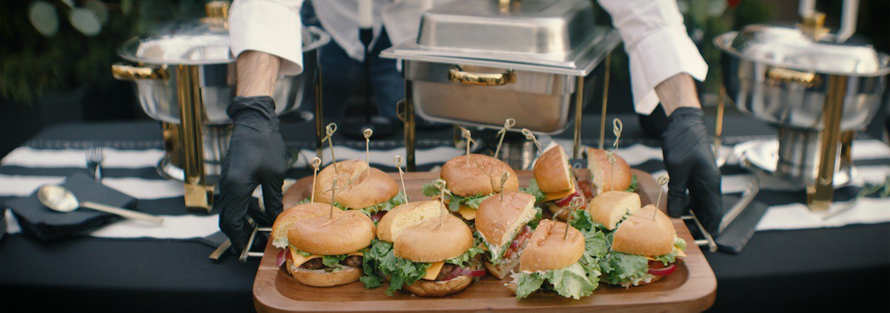 Catering team setting out sliders